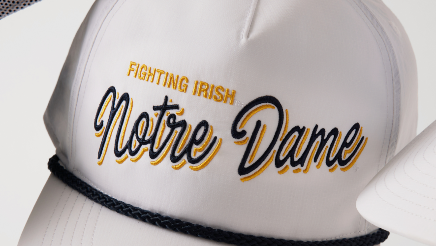 Detail image of front of hat with Notre Dame Fighting Irish on the front