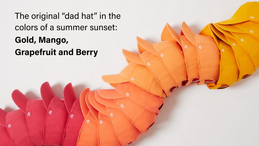 Colorful 'dad hat' in gold, mango, grapefruit, and berry on a white background. The original "dad hat" in the colors of summer sunset: berry, gold, grapefruit, and mango.