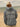 A man on the beach wearing a Chicago Cubs sweatshirt