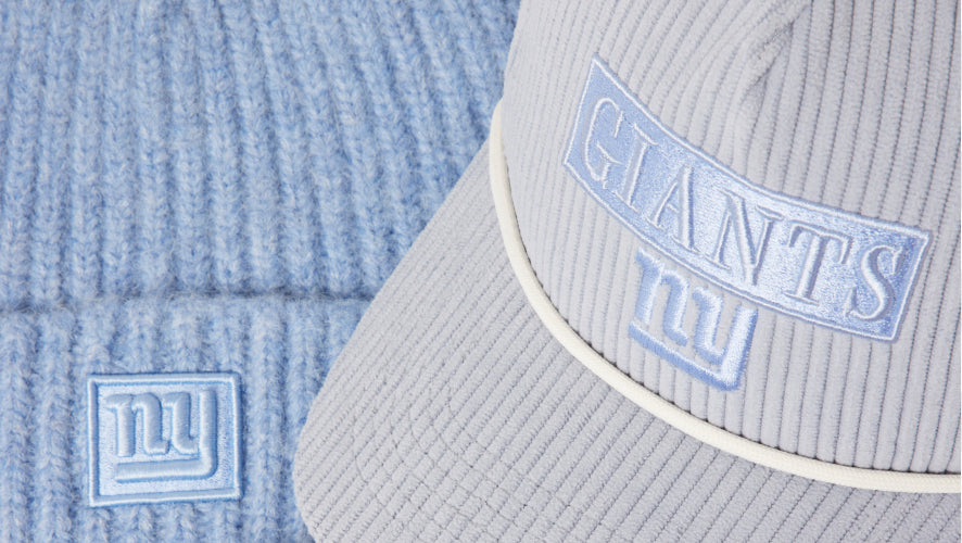 Gray cap with 'GIANTS' logo on a textured blue background