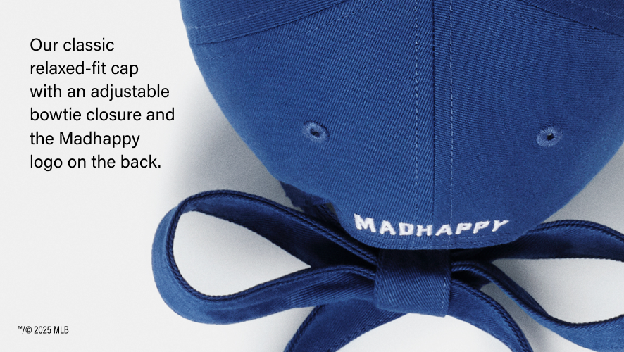 Our classic relaxed fit cap with an adjustable bowtie closure and the madhappy logo on the back. Top angel of bow tie hat in royal.