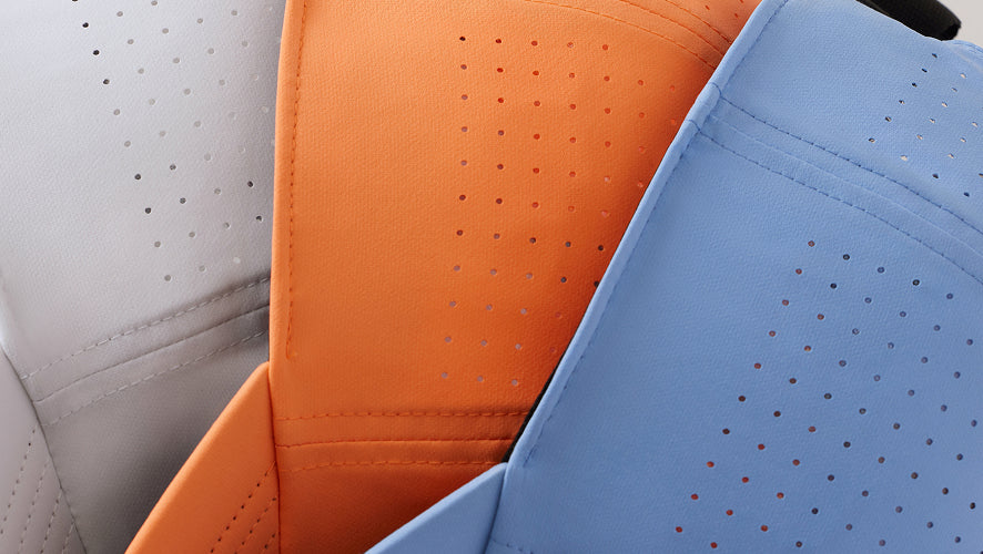 the side details of grey, orange, blue clean up hats.