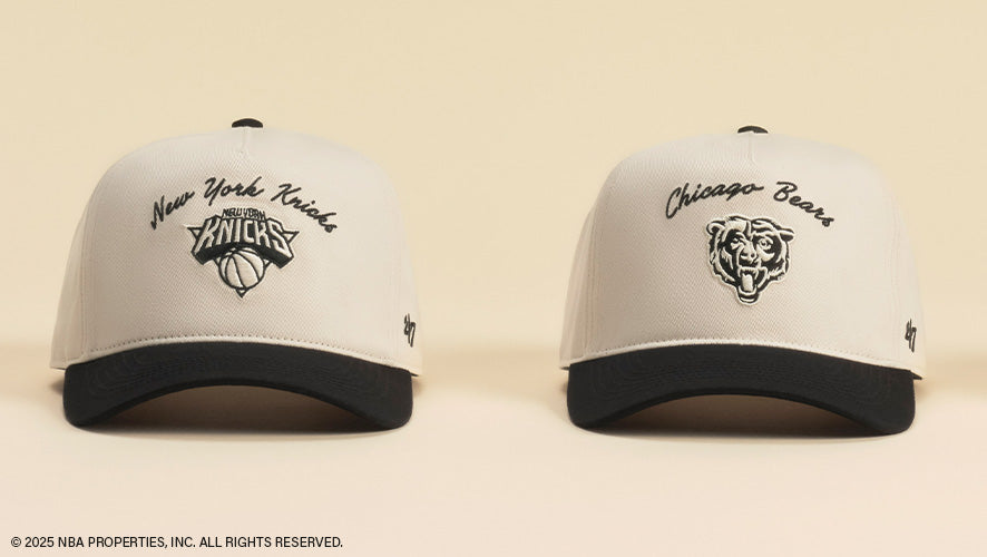 Image of two cream and black hats on a cream background.