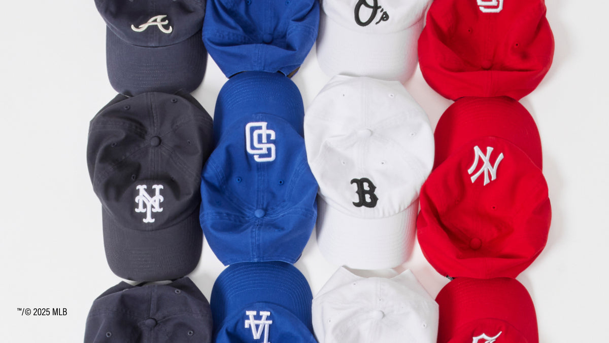 four lines of navy, royal, white & red mlb clean up hats.
