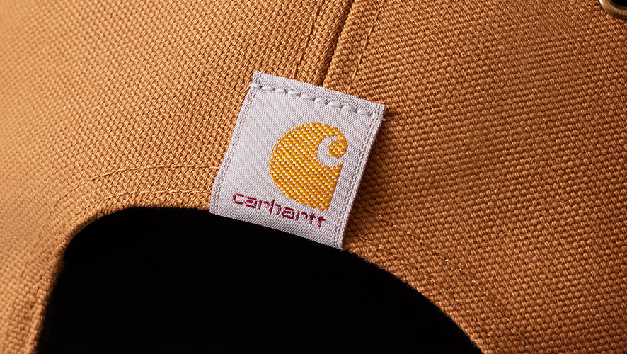 detail image of the back of a carhartt hat and logo of carhartt