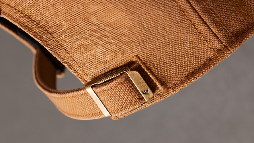 detail image of the back enclosure of a carhartt hat