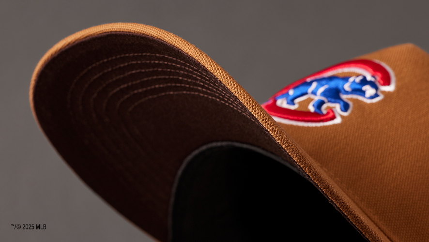 detailed image of the brim of a carhartt hat with a cubs embroidered logo