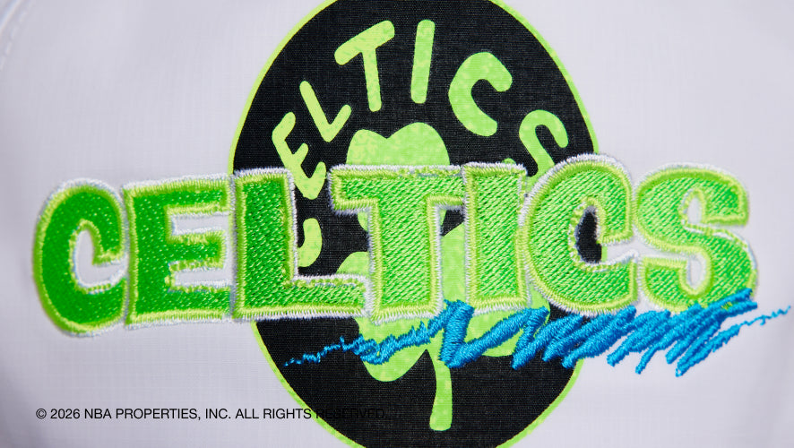 Embroidered Celtics logo on a sports jersey with NBA properties watermark.