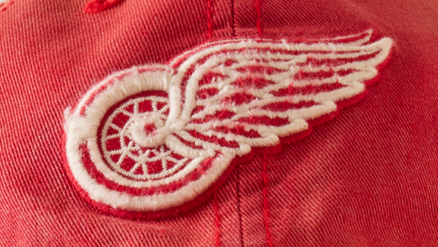 Red cap with a white logo 