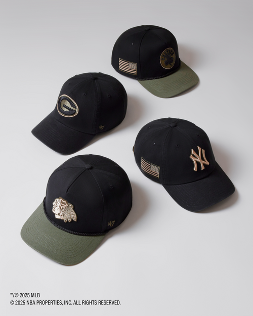 Four black baseball caps with various logos on a white background