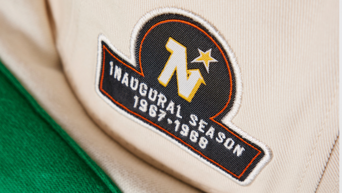 Inaugural season patch on a sports uniform with a star and text