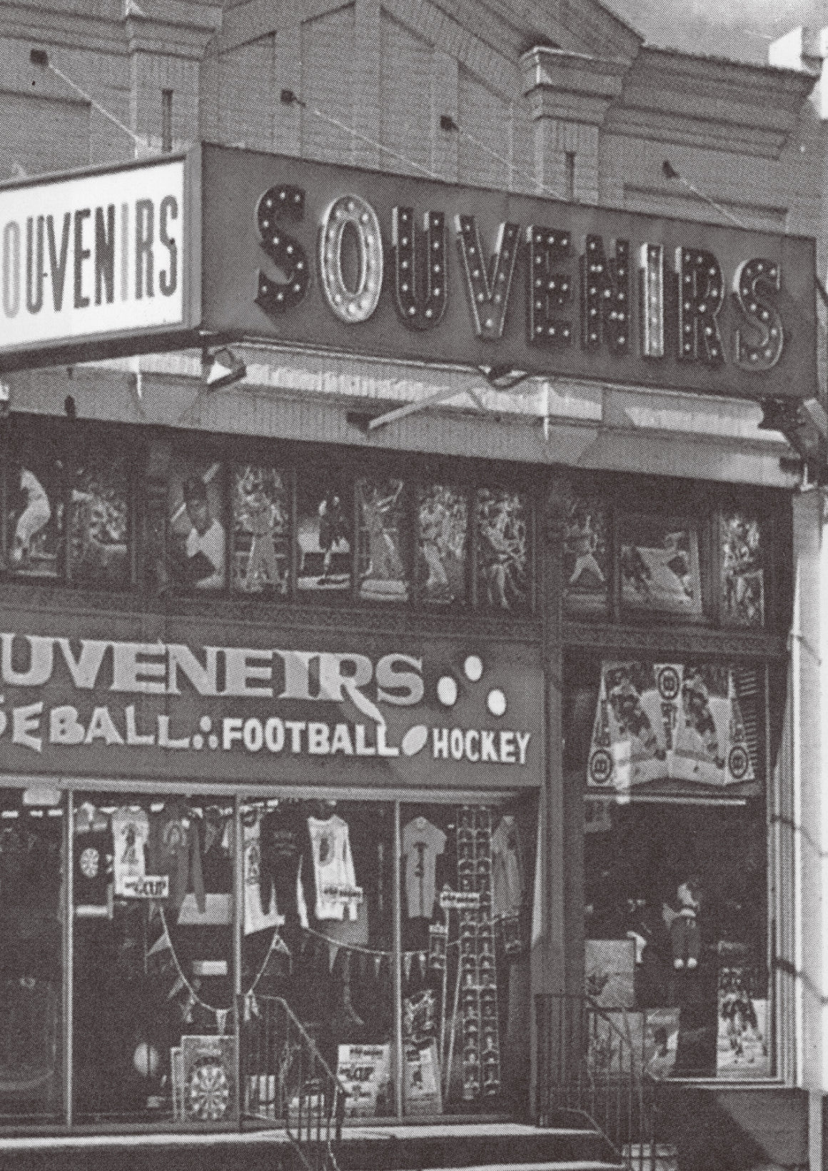 Vintage store front with 'Souvenirs' sign and sports-themed merchandise.