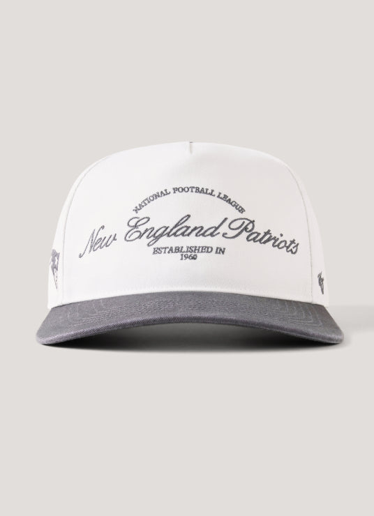 White cap with 'New England Patriots' text on a gray background