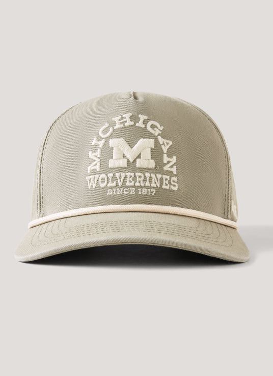 Beige cap with 'Michigan Wolverines Since 1847' text on a light gray background