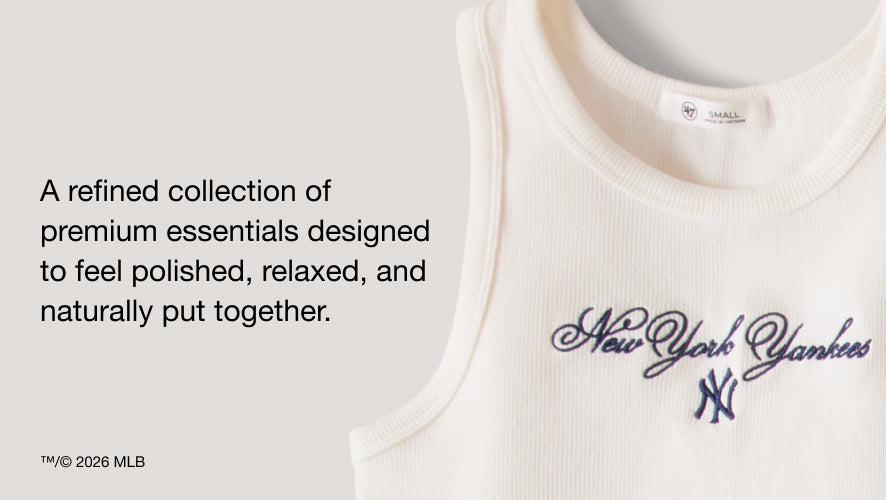 White tank top with New York Yankees logo on a light gray background. a refined collection of premium essentials designed to feel polished, relaxed and naturally put together