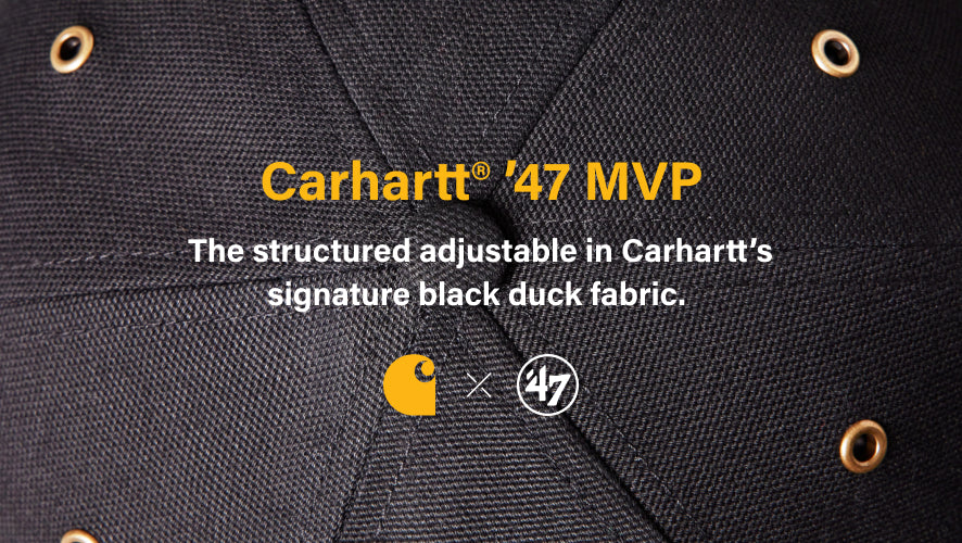 Close-up of Carhartt '47 MVP jacket with brand logos and text. CARHARTT '47 MVP- THE STRUCTURED ADJUSTABLE IN CARHARTTS SIGNATURE BLACK DUCK FABRIC