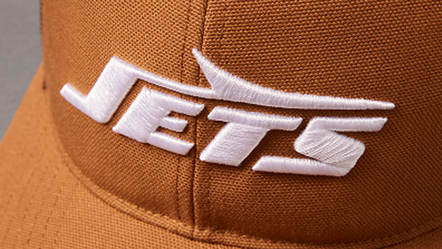 Brown cap with 'JETS' embroidered in white on a brown background