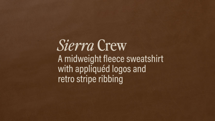 Sierra Crew. A midweight fleece sweatshirt with appliqued logos and retro stripe ribbing.