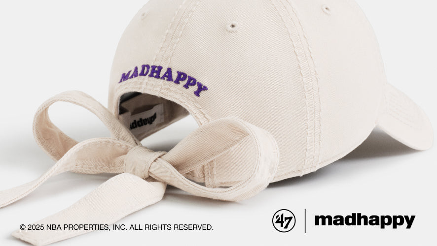 Beige cap with 'madhappy' branding on a white background