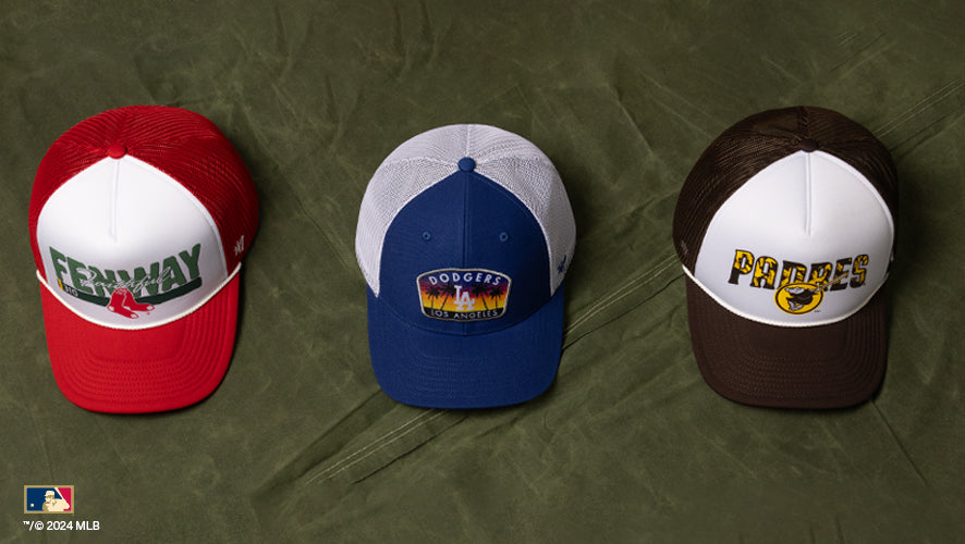 Three mesh trucker caps featuring Fenway Park, LA Dodgers, and San Diego Padres graphics.