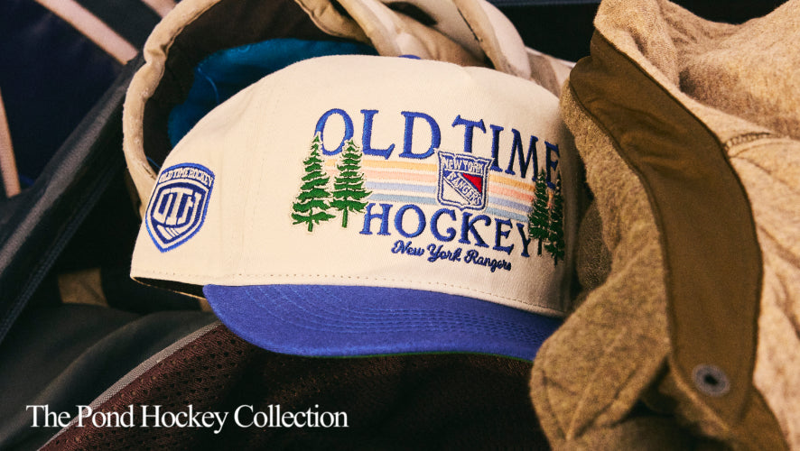Old Time Hockey cap with logo and text on a textured surface