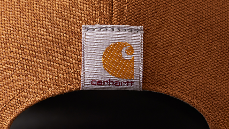 detail image of the carhartt logo on the back of a carhartt hat
