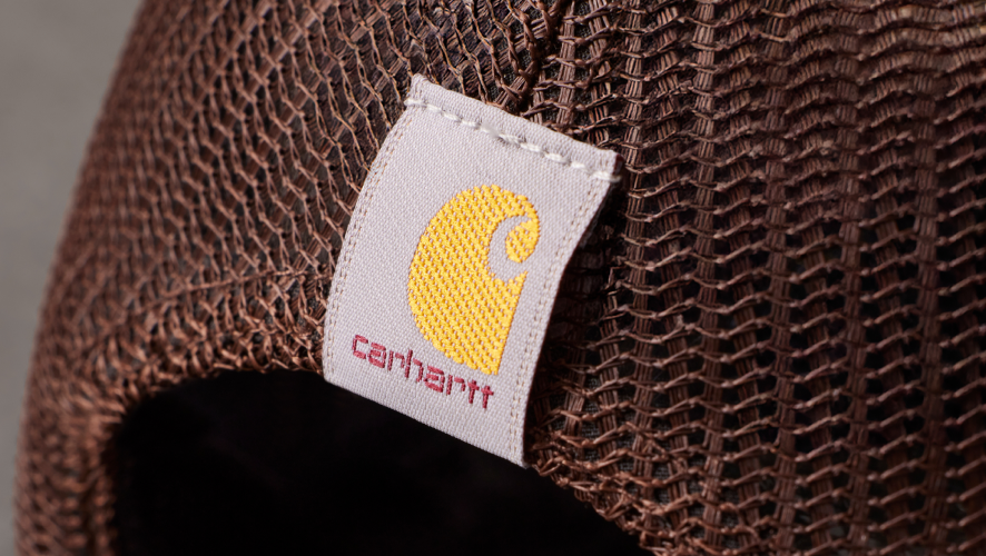 detailed image of the mesh back of the carhartt hat with a carhartt logo.