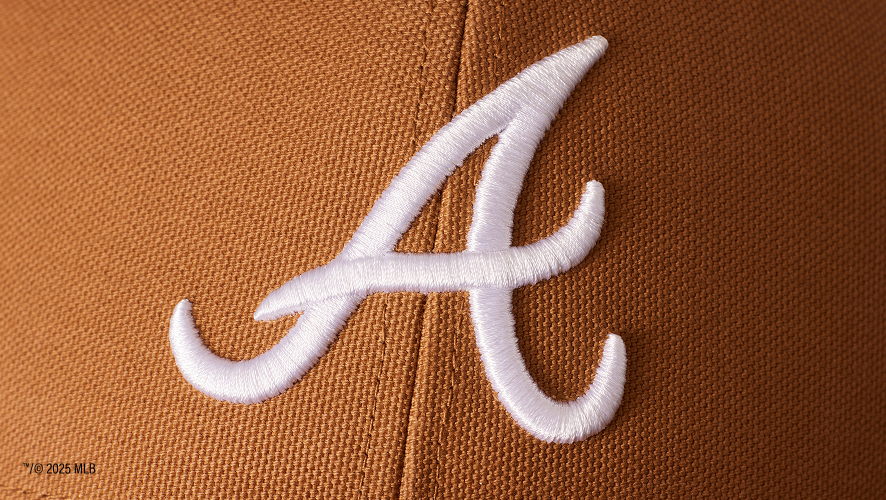 detail image of the front of a carhartt hat with braves logo