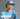 Person wearing a blue cap and sweatshirt with text promoting. The Trendy Team Collection. THE TRENDY TEAM COLLECTION- Bring a touch of glamour to game day- SHOP COLLECTION. 
